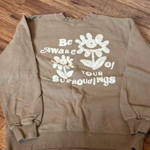 “be aware of your surroundings” crewneck